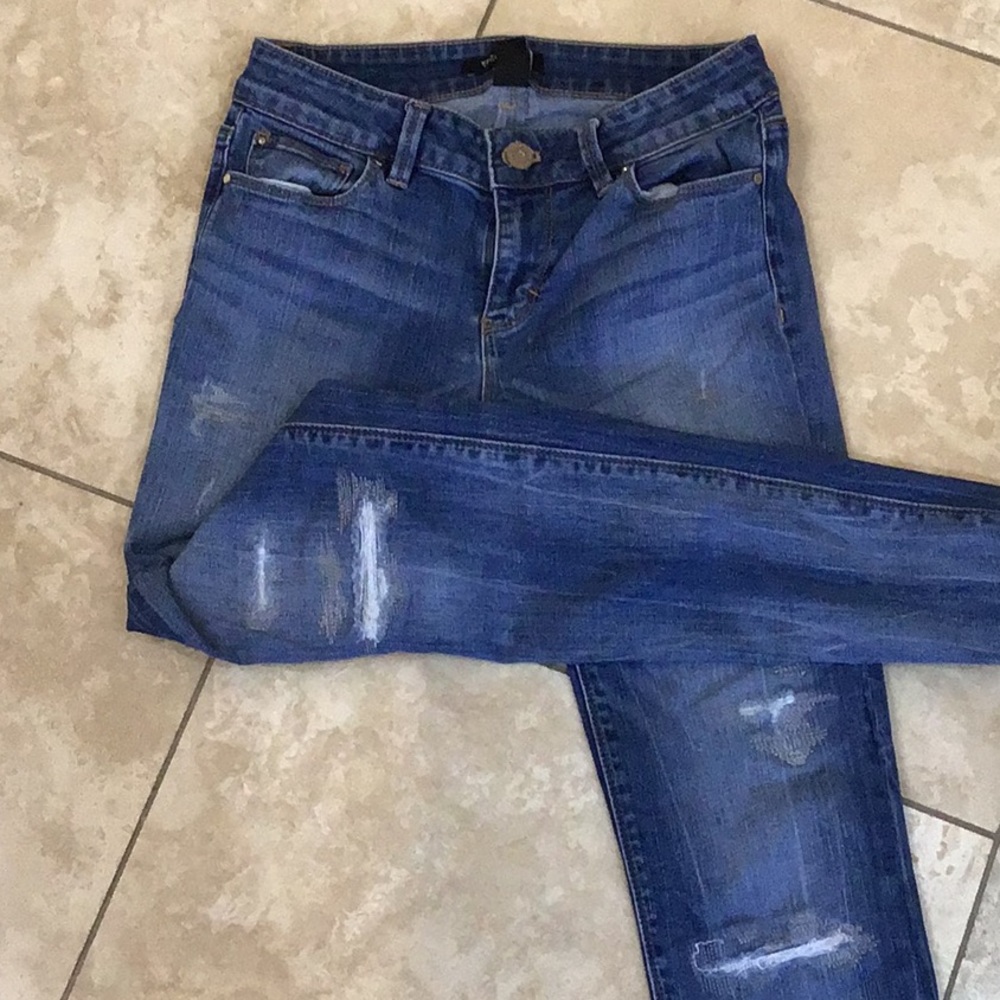 Distressed skinny jeans.